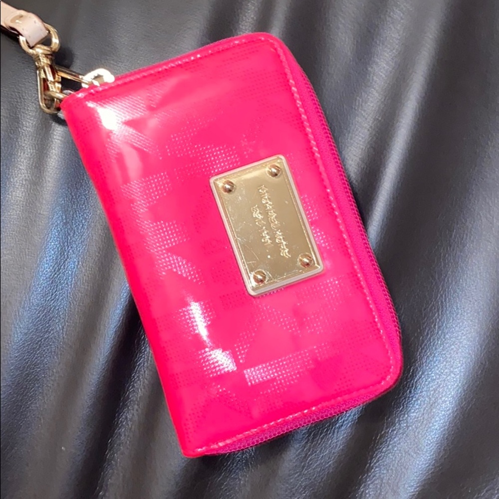 Michael Kors wristlet with a few stains